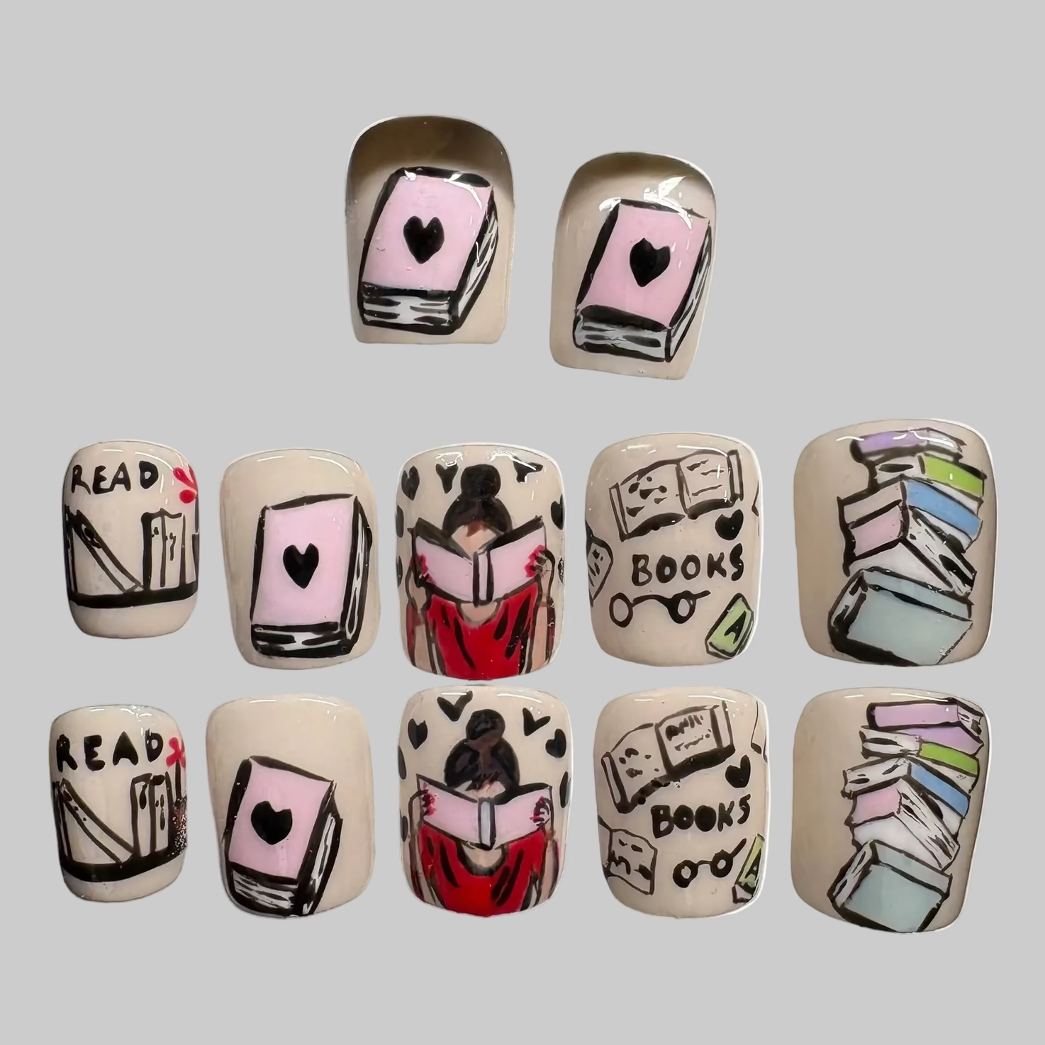 The Storyteller celebrates the culture of books and reading. Encompasses all culture. Books and nails. The base is a cream nude with line art work done with color gels.