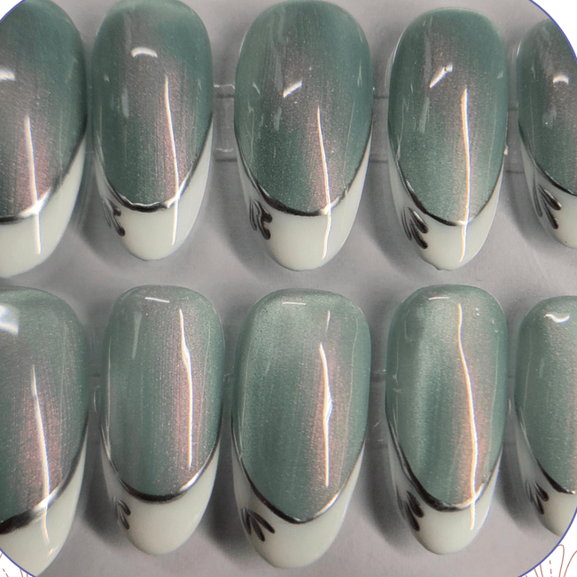 French with a Twist nails featuring classic white tips with shimmering cateye base nail.