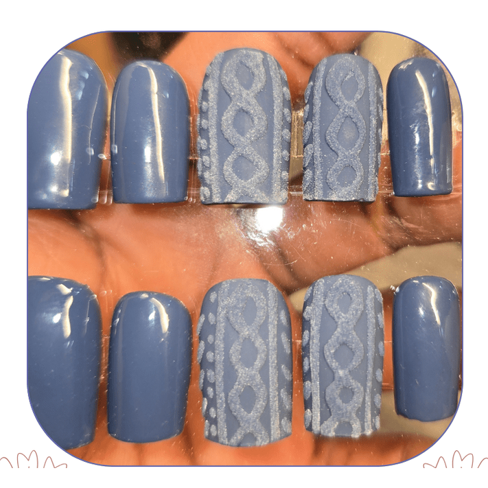 3D cable knit sweater press-on nails in matte blue gray, square shape, winter-themed textured nail art.