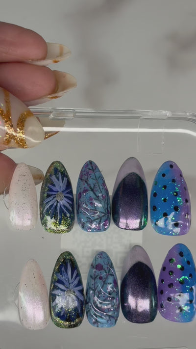 Application of blue and purple iridescent, 3D nails with polka dots, line art and floral patterns on natural nails